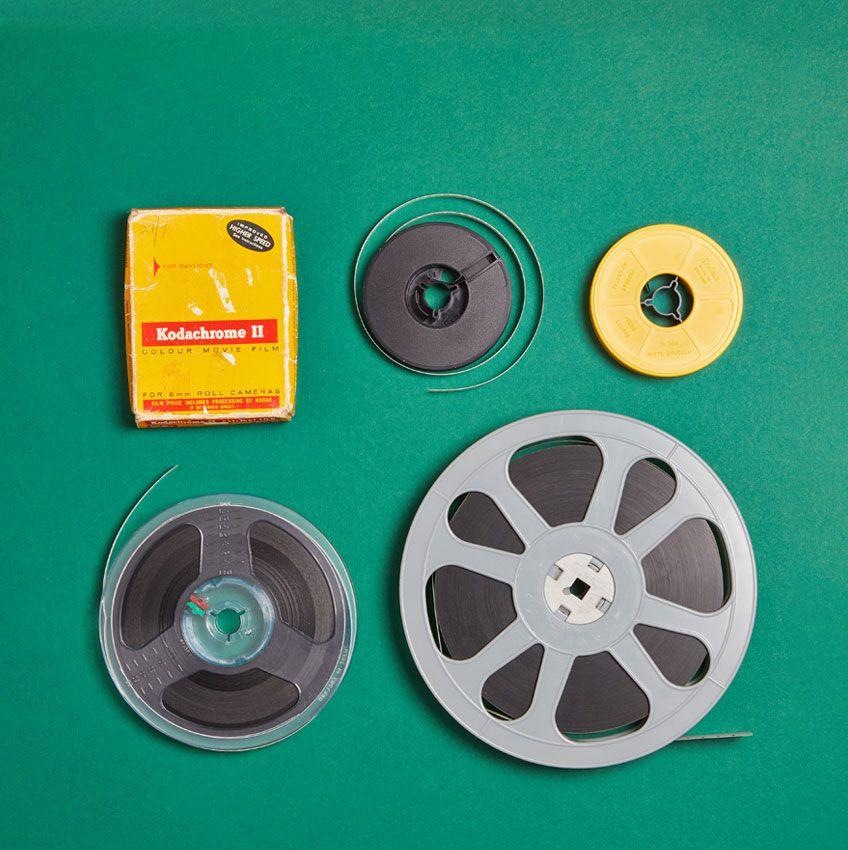 Cine film reels on a green background